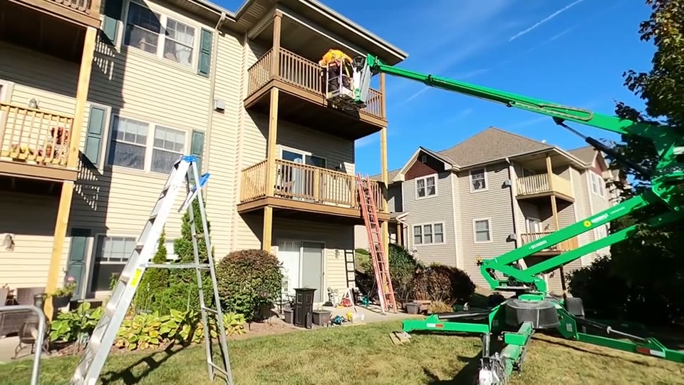 Crew working on elevated wood decks at a Grafton property